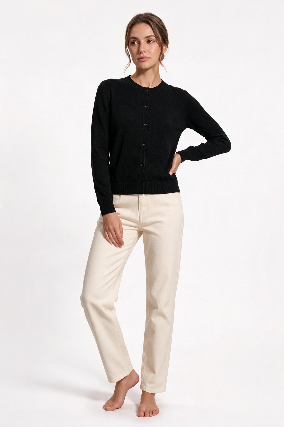 The Fine-Gauge Cardigan in black, front view, full length