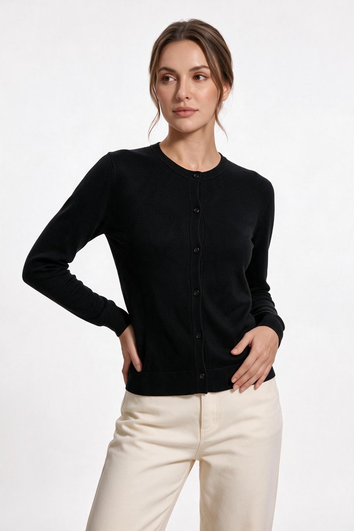 The Fine-Gauge Cardigan in black, half-body view