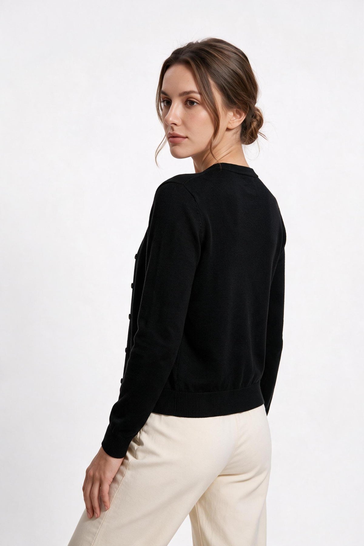 The Fine-Gauge Cardigan in black, back view