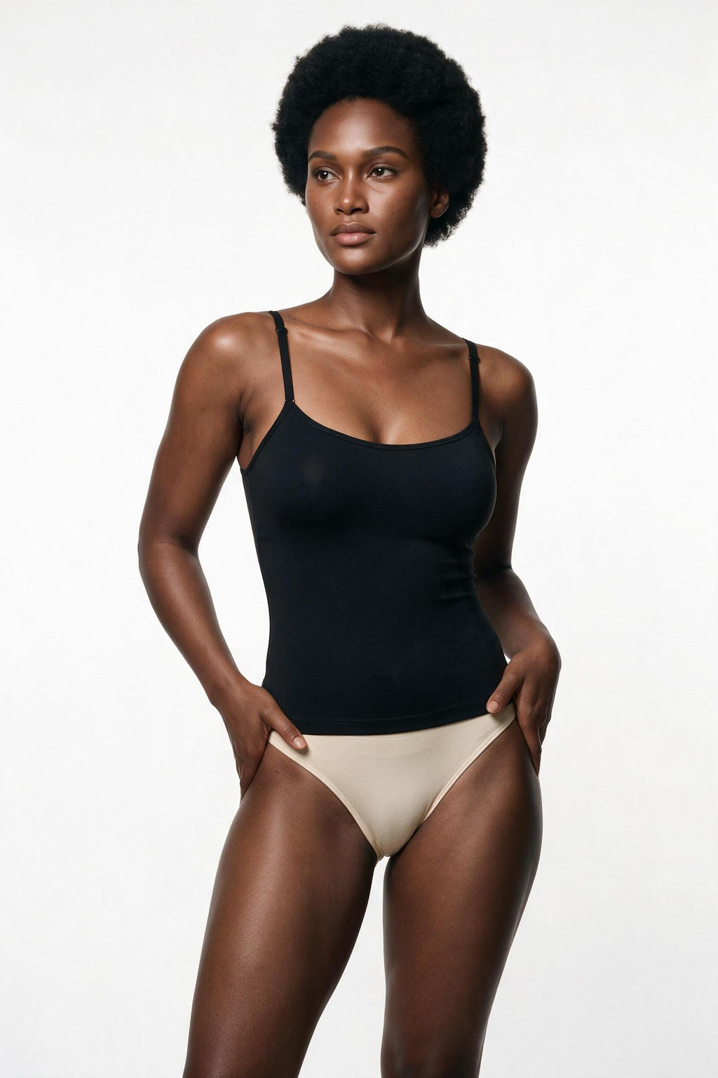 The Soft-Scoop Cami in black, half-body view