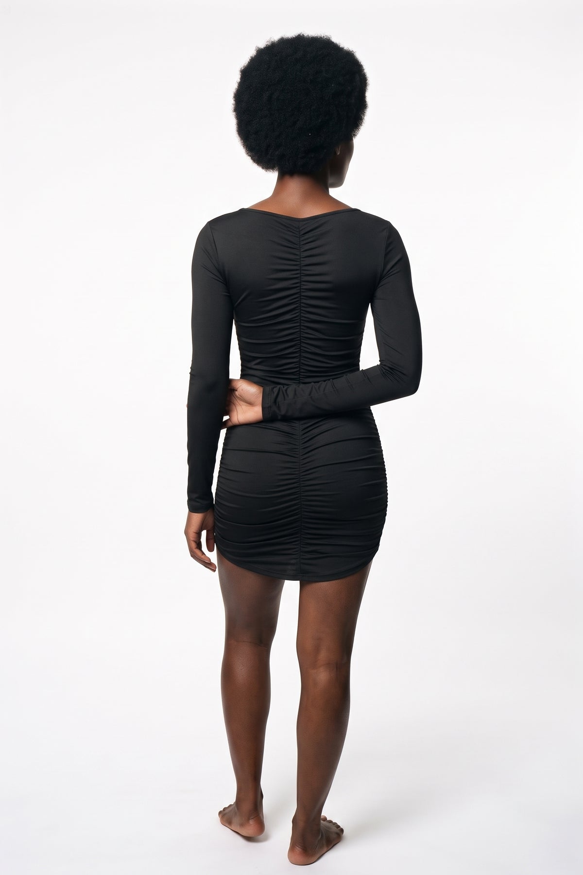 The Ruched Wrap Mini Dress in black, back view