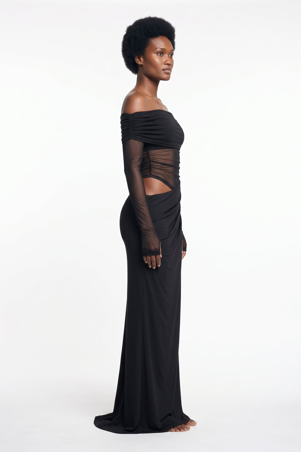 The Off-Shoulder Mesh Maxi Dress in black, side view