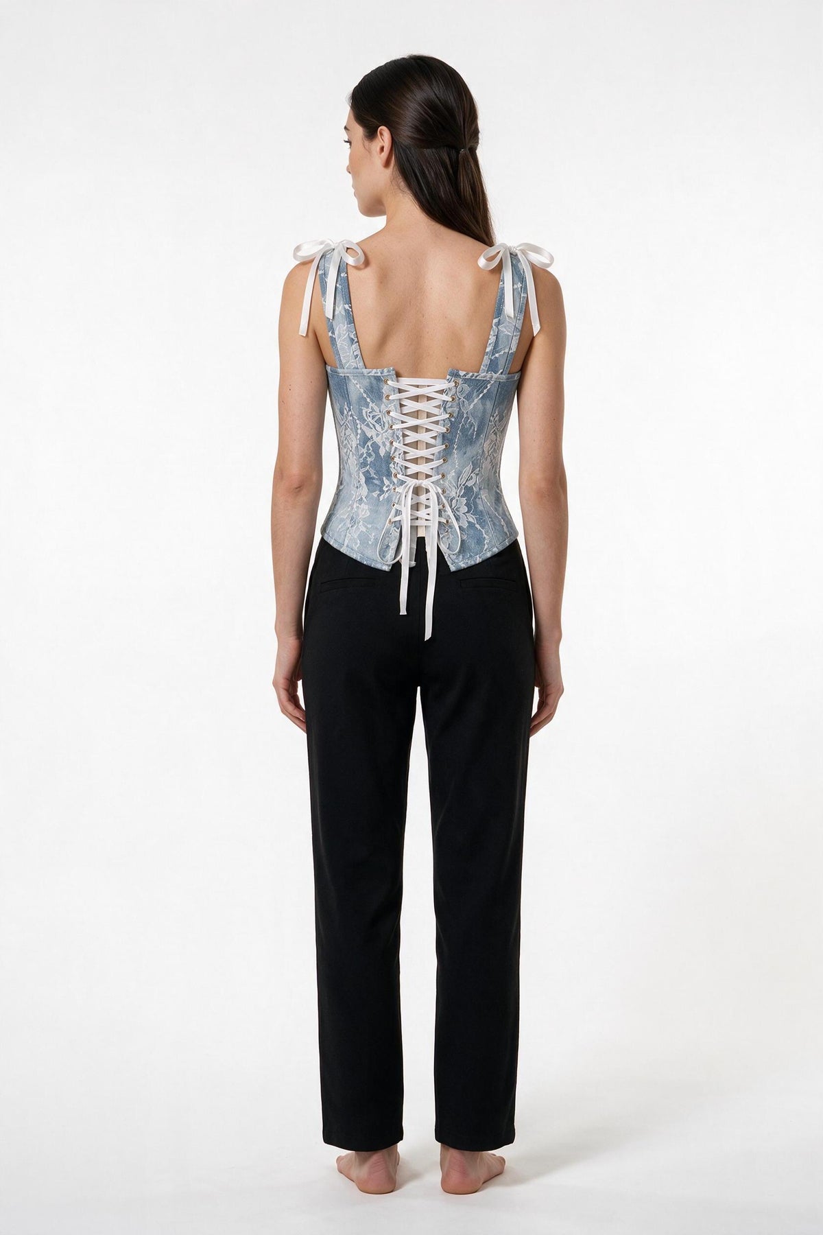 The Denim Lace Corset Top in light denim, back view