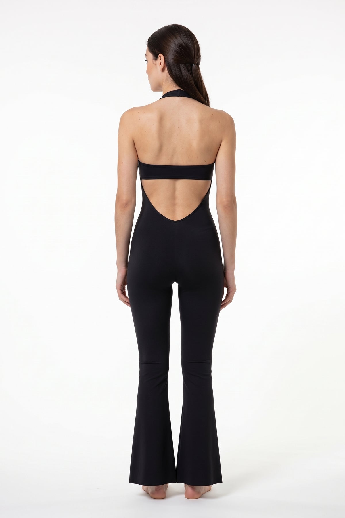 The Halter Lace Flare Jumpsuit in black, back view