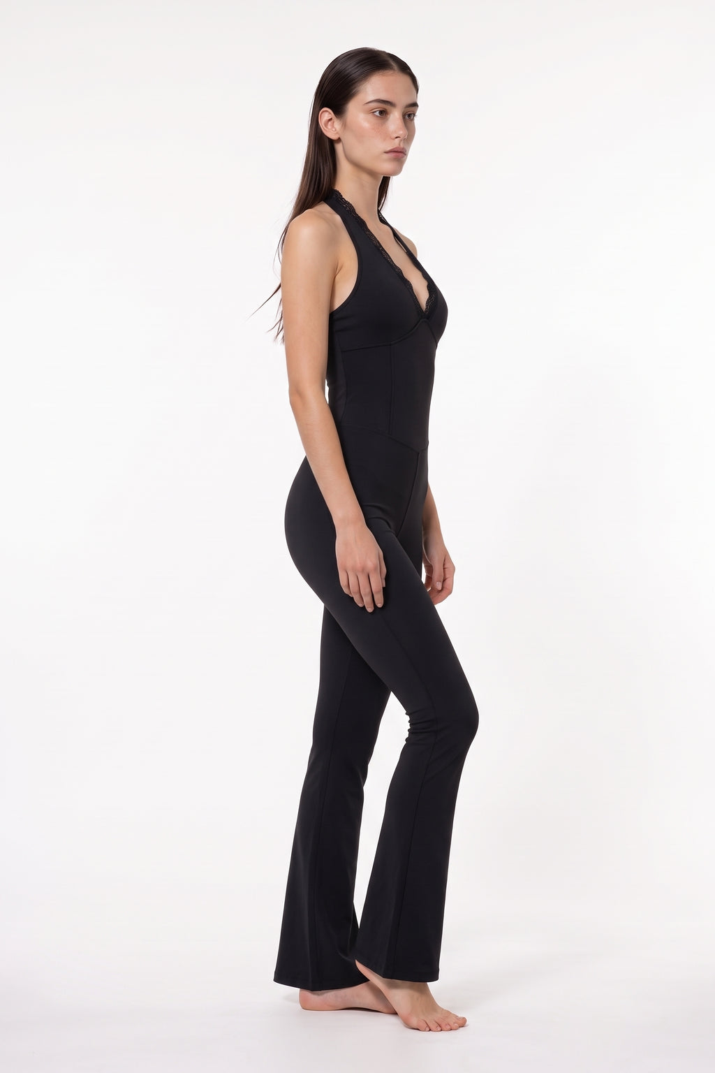 The Halter Lace Flare Jumpsuit in black, side view