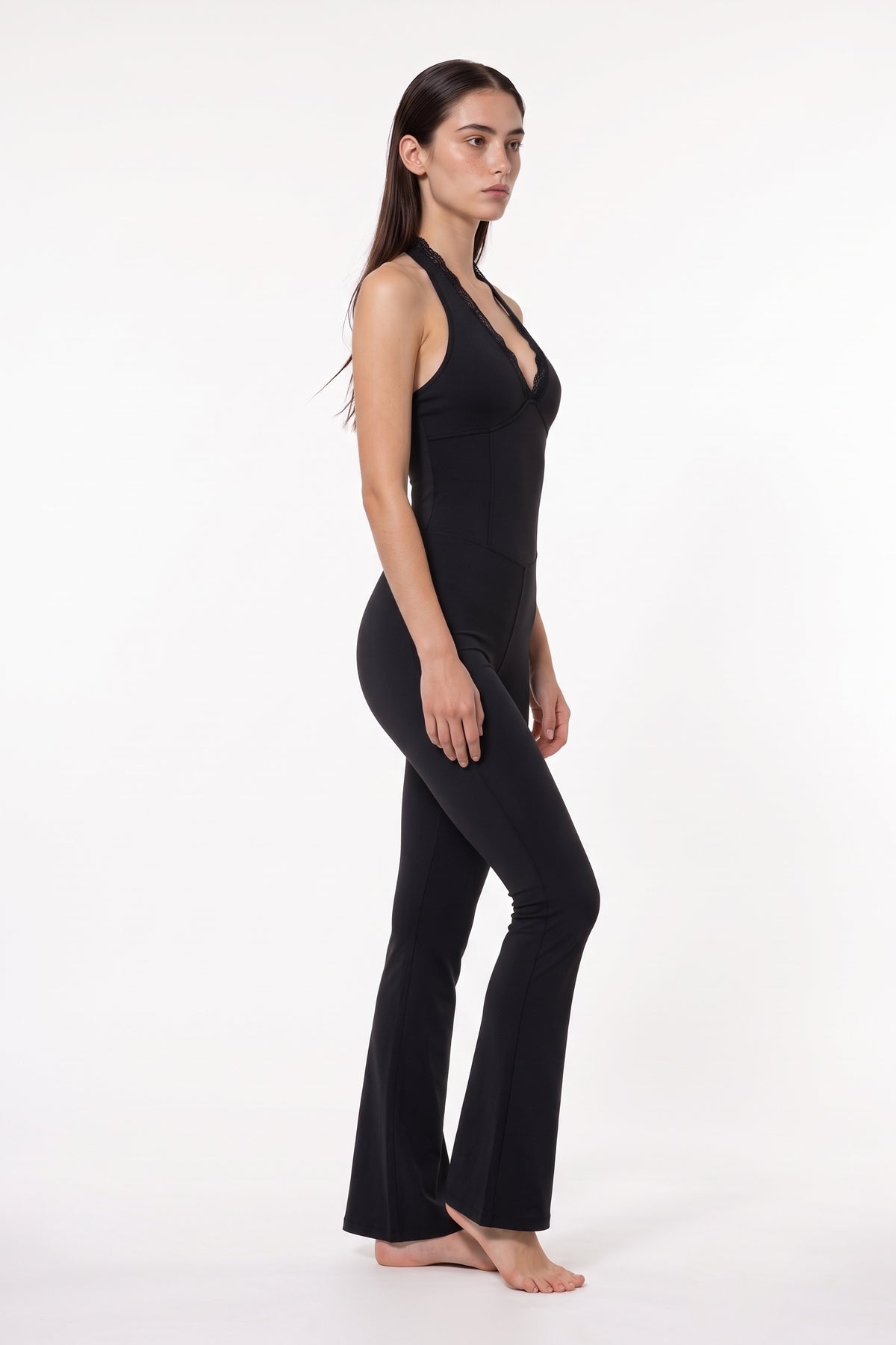 The Halter Lace Flare Jumpsuit in black, side view