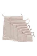 The Linen Wash Bag in natural cotton, drawstring closure, shown on a white background